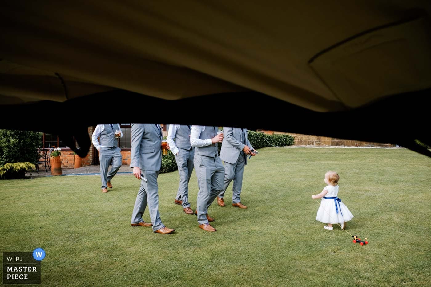 Male guests and child at a wedding