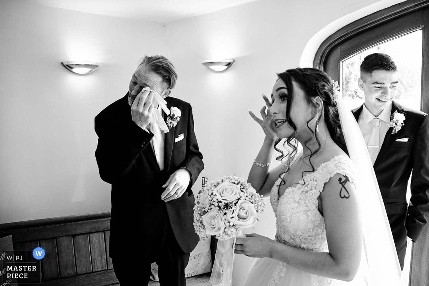 Tearful father of bride and bride