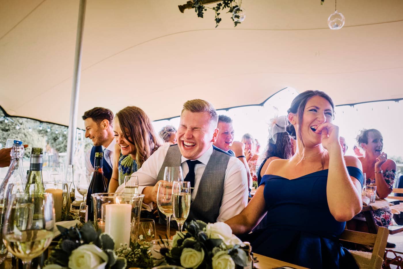 Guests laughing during speeches