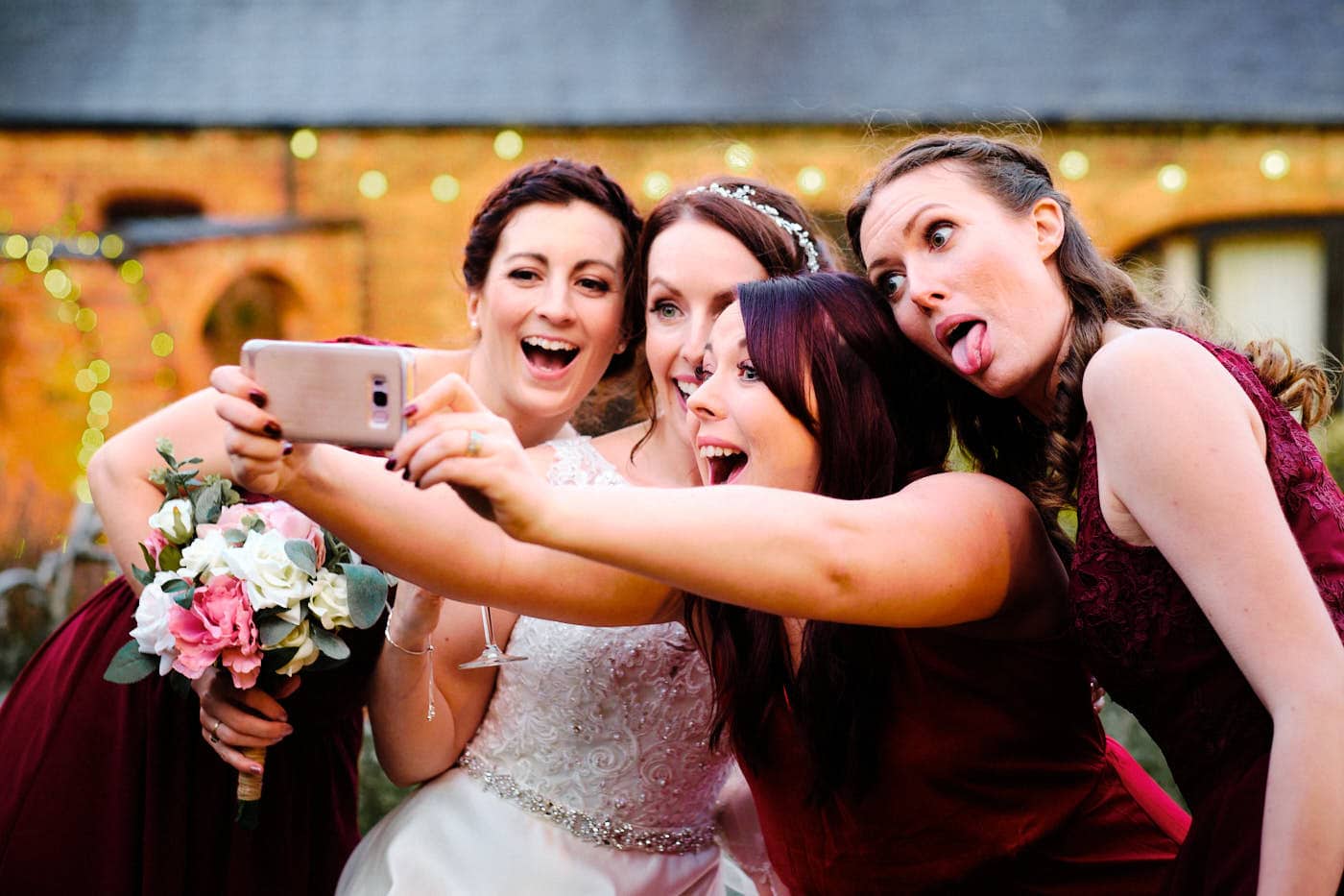 Bride with girlfriends taking a selfie