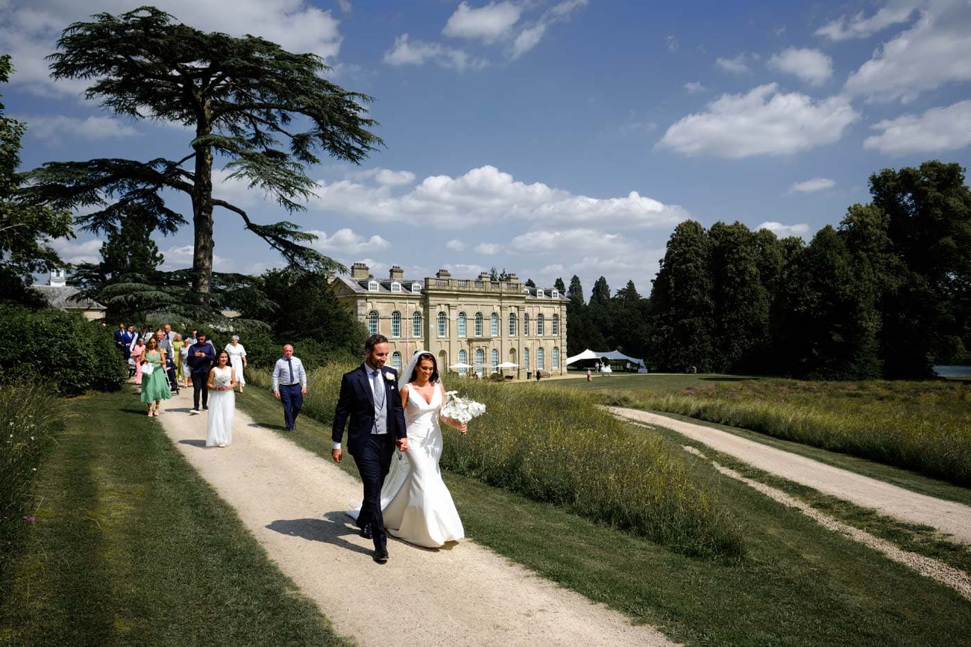 Bride and Groom leaving Chapel and walking to Compton Verney